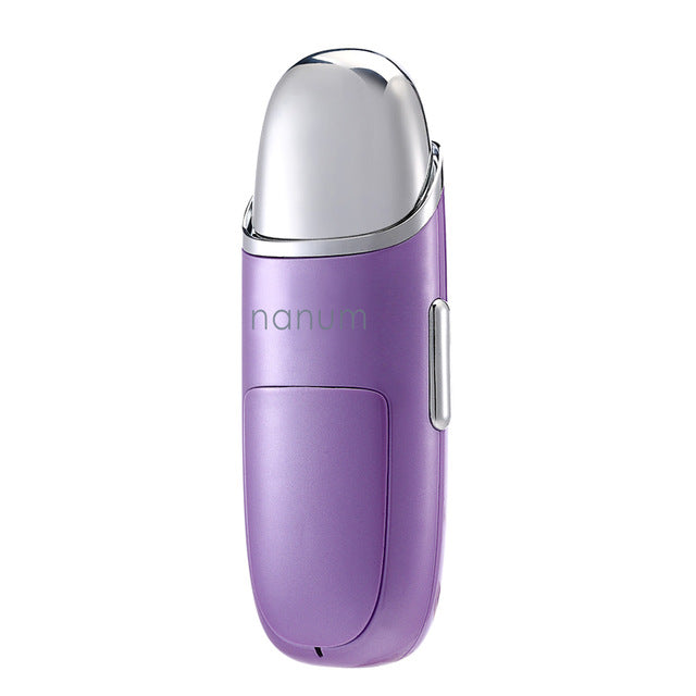 Purple Nanum portable facial steamer with silver top and side button on white background