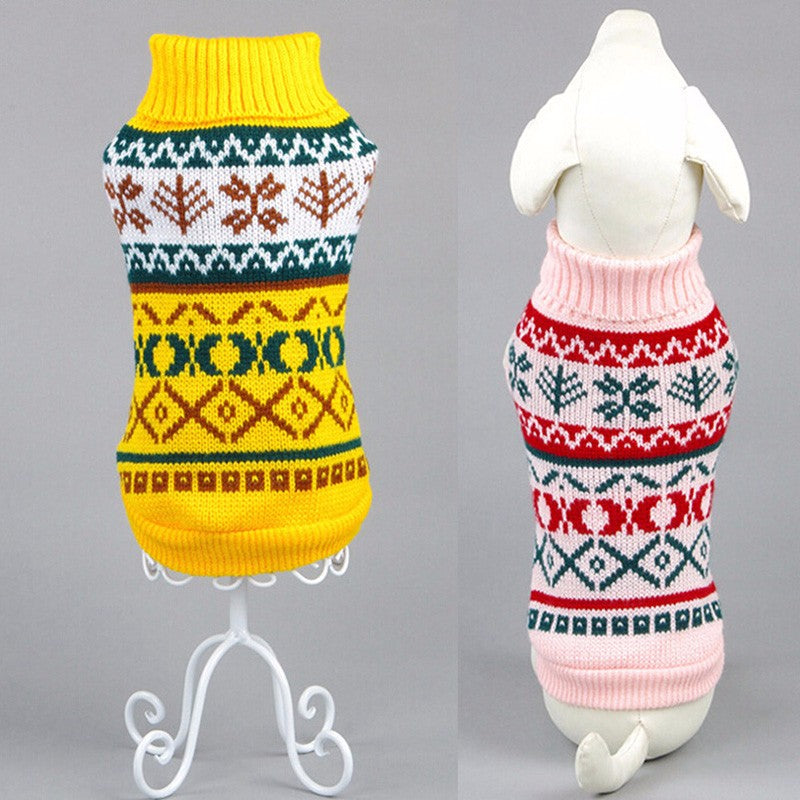Yellow and pink knitted dog sweaters with geometric and floral autumn patterns on mannequins