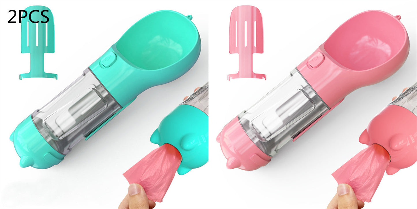 Two portable 500ml pet water bottles with attached pink and turquoise dog feeders and scoop, dispensing waste bags
