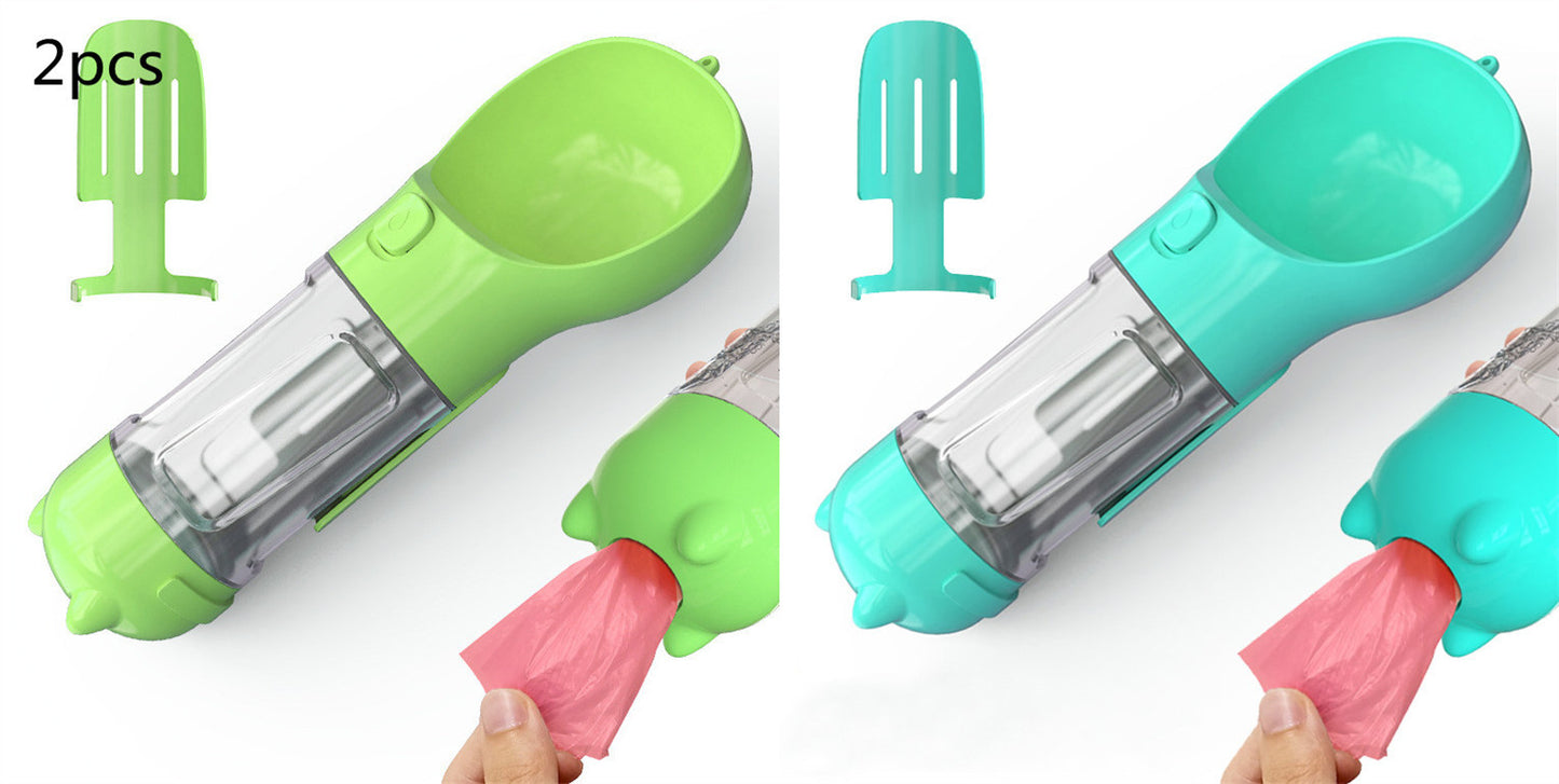 Two portable pet water bottles with attached dispensers and pink waste bags, one green and one blue, with two matching scoops