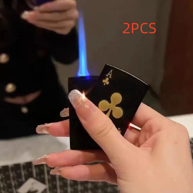 Hand holding black poker card-themed zinc alloy lighter with blue flame and ace of clubs design