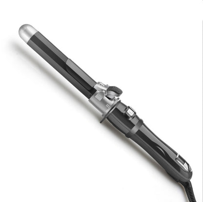 Black automatic curling iron with ceramic barrel and LCD display on white background