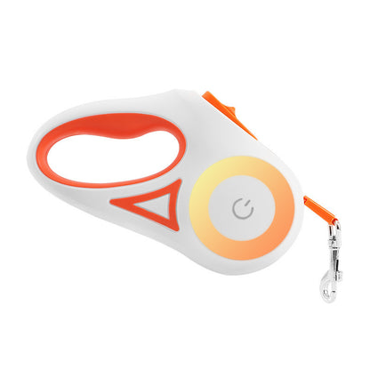 White and orange retractable dog leash with ergonomic handle and metal clip on white background