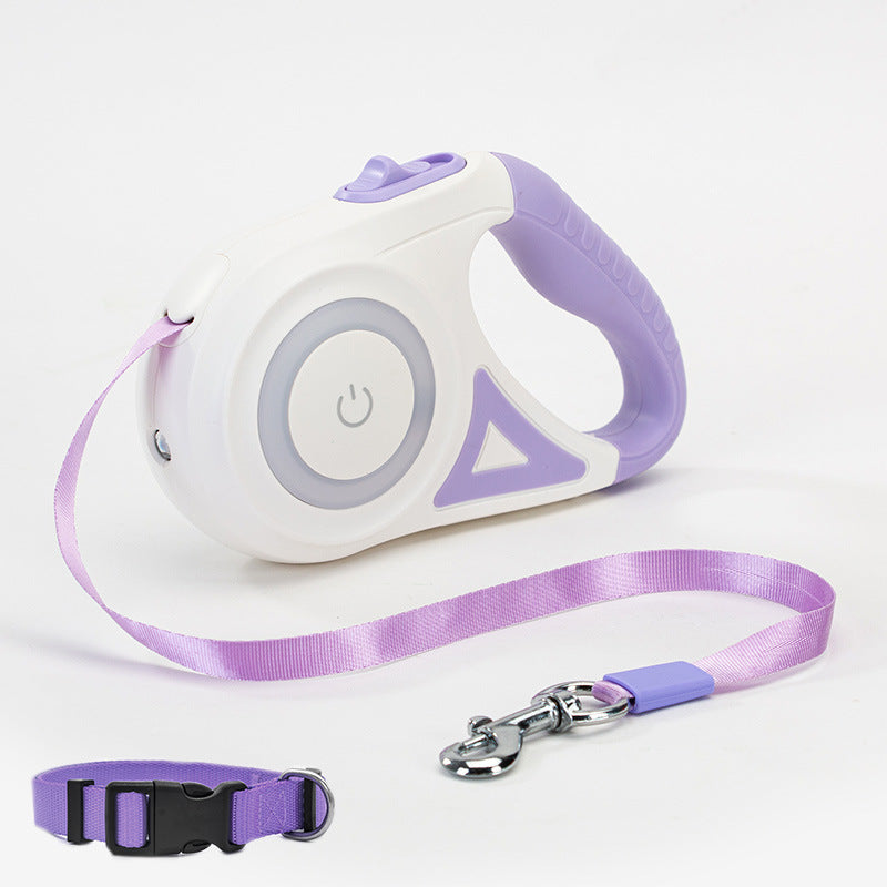 Purple and white retractable dog leash with ergonomic handle and matching purple pet collar on white background