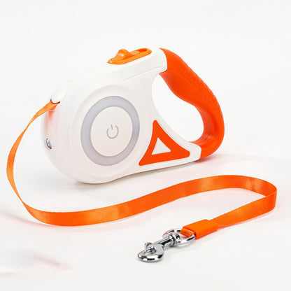 White and orange retractable dog leash with ergonomic handle and orange nylon strap on white background