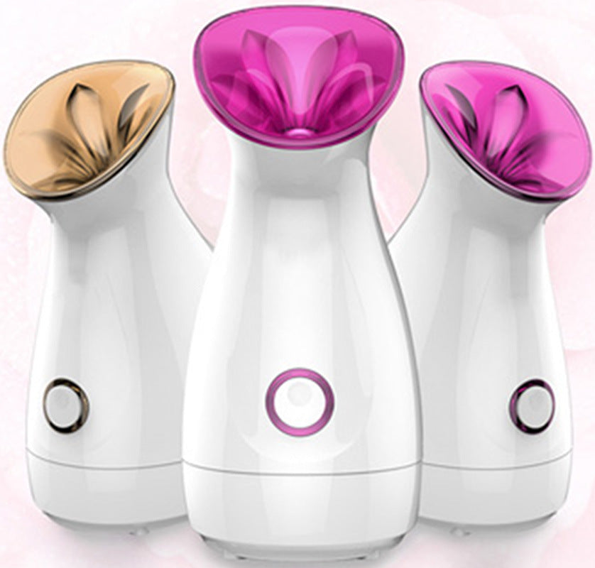 Three Trendoligy Nano Ion Facial Steamers with white bodies and colorful openings for hot moisturizing spray