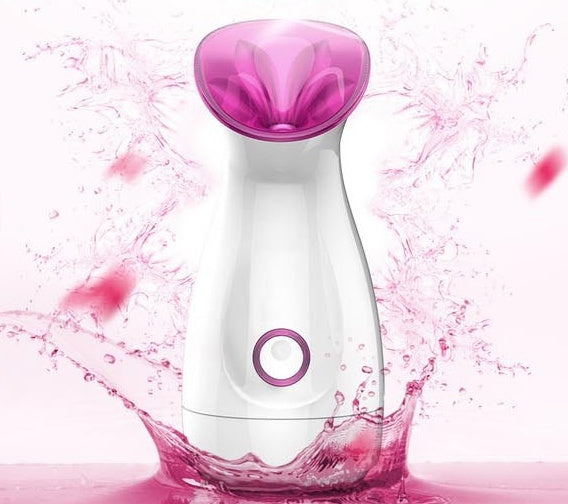 White and purple Trendoligy nano ion facial steamer with hot spray splash on pink background
