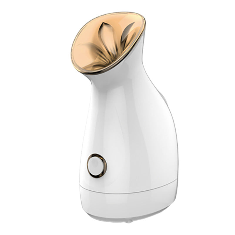 white facial steamer with gold steam outlet and single control button on white background