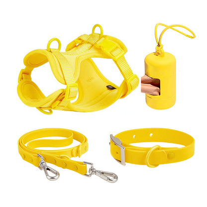 Yellow dog harness, leash, collar, and waste bag dispenser set for outdoor use
