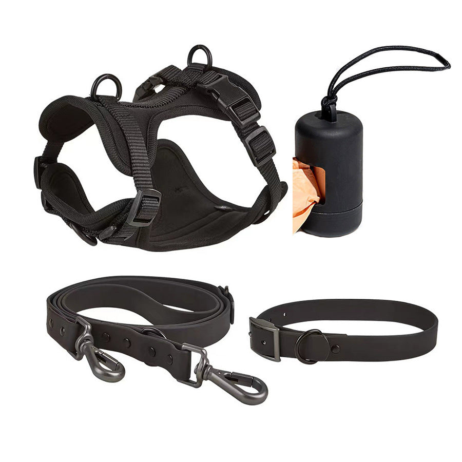 Black dog tactical harness, leash, collar, and waste bag dispenser set on white background