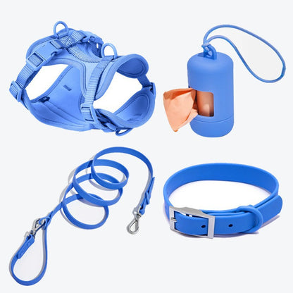 Blue four-piece dog set with adjustable harness, leash, collar, and poop bag dispenser