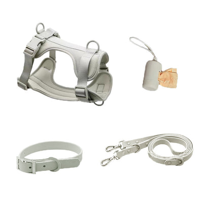Gray waterproof dog harness set with collar, leash, and waste bag dispenser for outdoor training