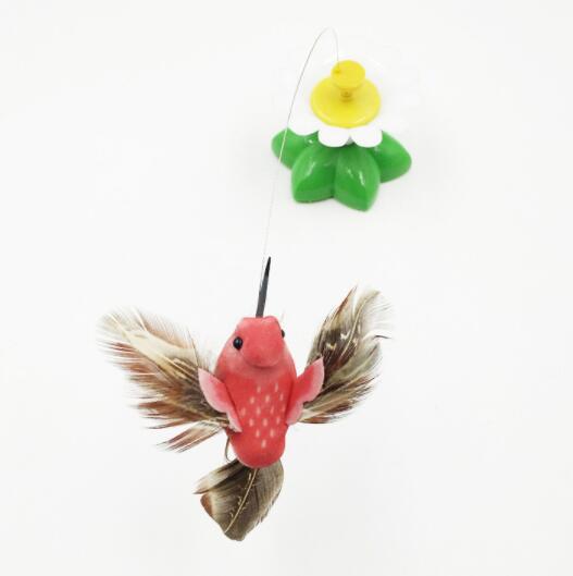 Interactive rotating cat toy with a red bird and natural feathers, mounted on a green flower base