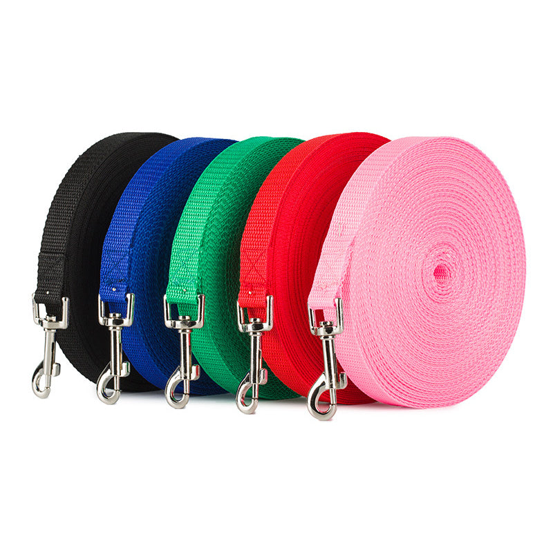 Rolls of durable nylon dog leashes in black, blue, green, red, and pink with metal clasps