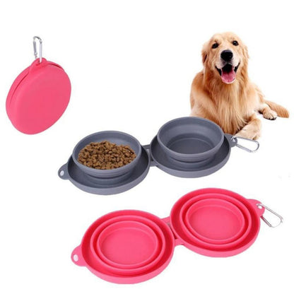 Collapsible double pet bowls in pink and gray with dog food, featuring carabiner clips and a happy golden retriever