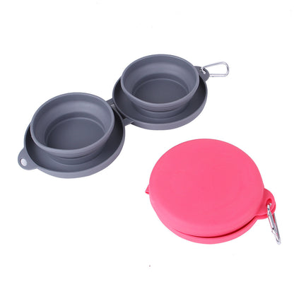 Foldable gray double pet bowl with pink collapsible cover and carabiner clip on white background
