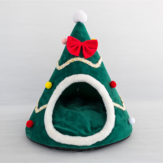 Christmas tree shaped cozy pet bed in green with red bow and colorful pom-poms, plush dog and cat nest