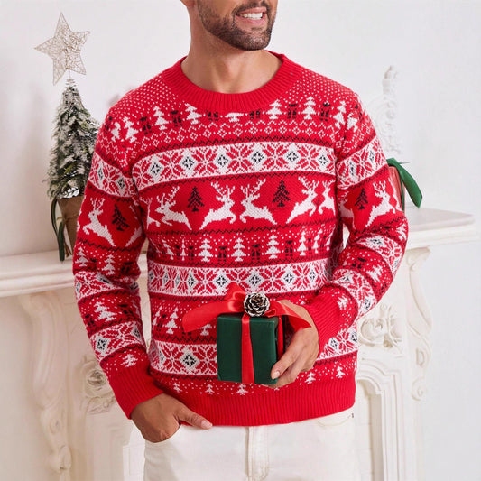 Man wearing red Christmas sweater with reindeer and tree patterns holding wrapped holiday gift