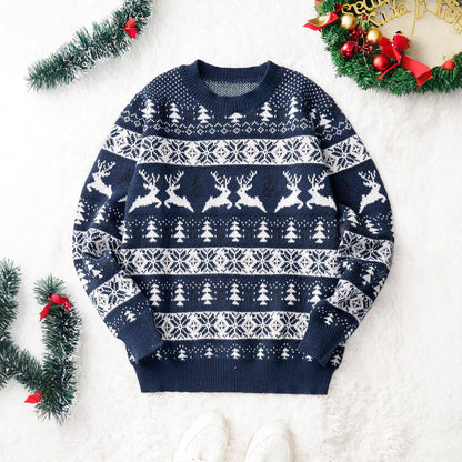 Navy blue Christmas sweater with white reindeer, snowflakes, and tree patterns on white background