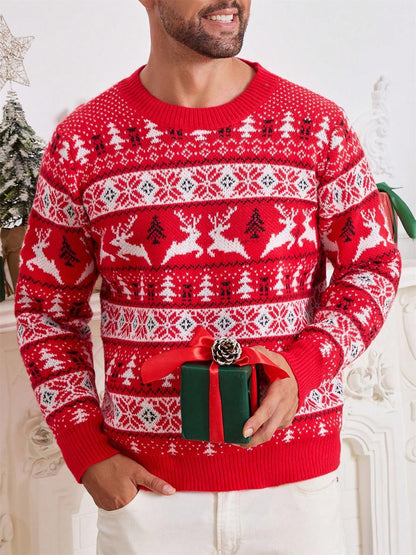 Man wearing red Christmas sweater with reindeer and tree patterns holding green gift box with red ribbon