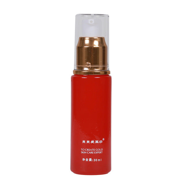 Red skincare bottle with gold pump and clear cap labeled moisturizing facial oil 30ml