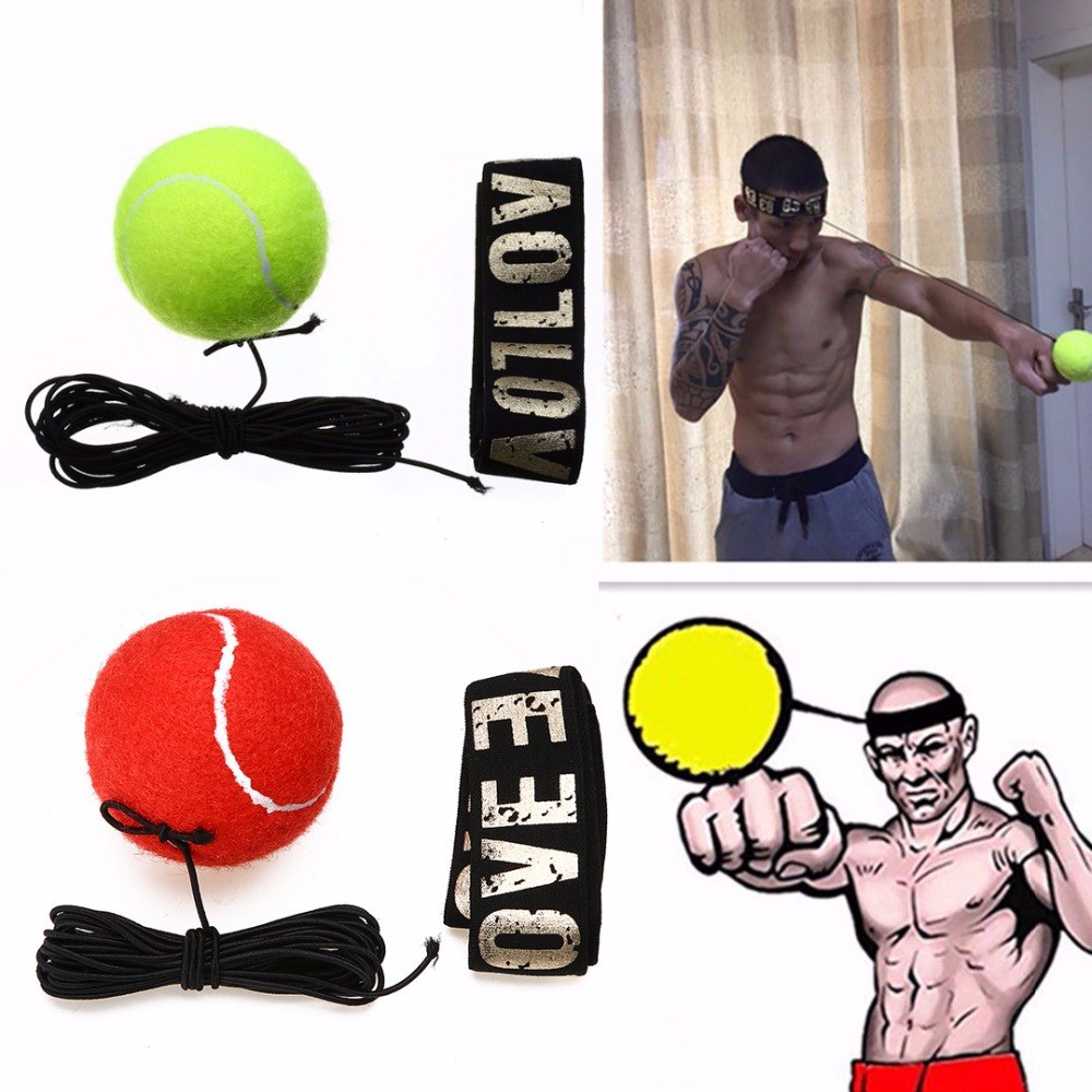 Red and green boxing reflex punch balls with elastic bands and wrist straps, man training punch reflexes indoors