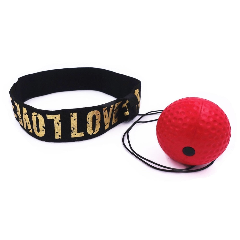 Red PU rubber reflex punching ball with black headband strap featuring gold text for boxing training