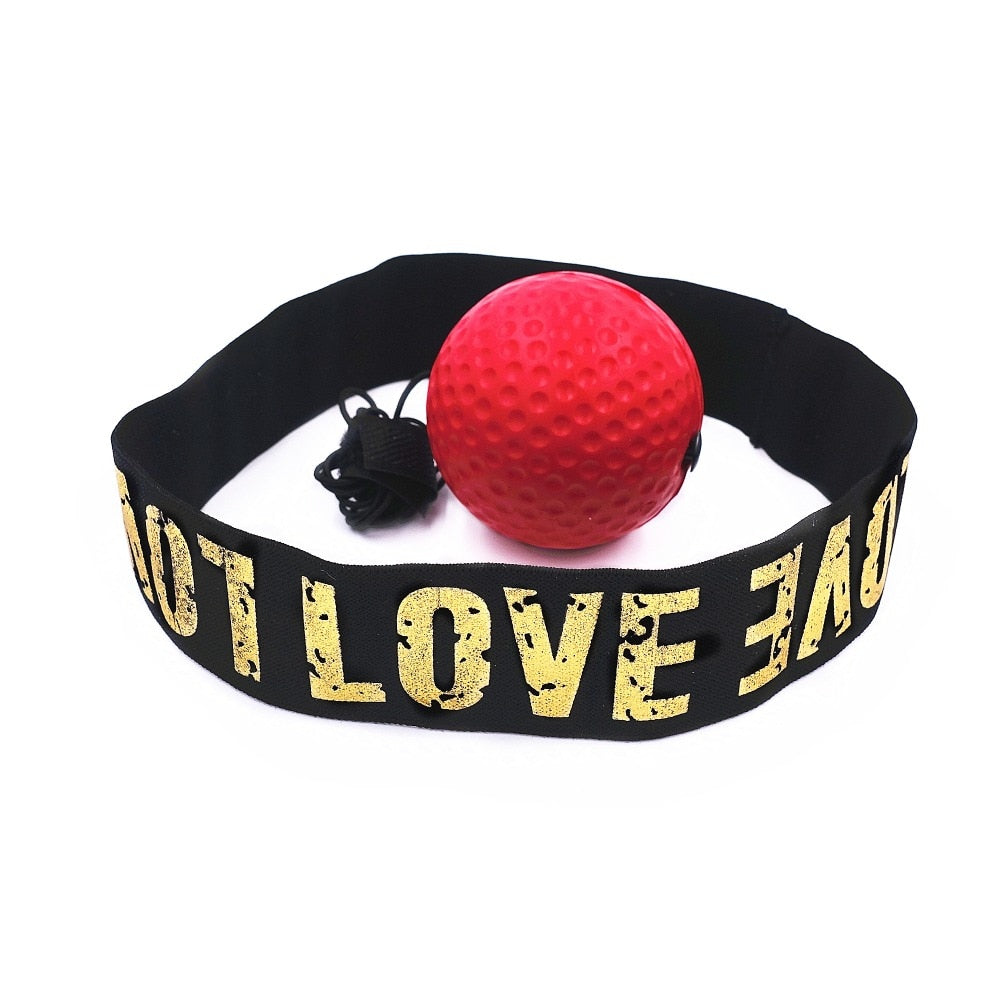 Red boxing reflex punch ball attached to black headband with yellow text 'LOVE' on white background