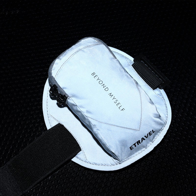 Reflective black and white running arm bag with 'BEYOND MYSELF' and 'ETRAVEL' text on black textured surface