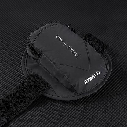 Black reflective running arm bag with zipper, text Beyond Myself and ETRAVEL on textured dark background