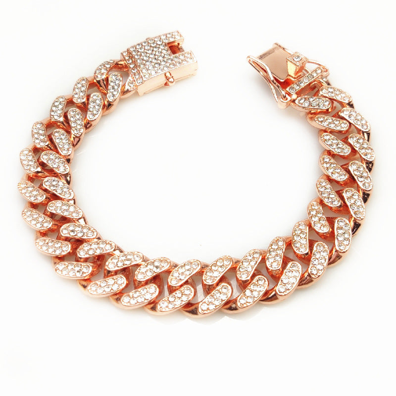 Rose gold chain bracelet with diamond-like stones and secure clasp on white background