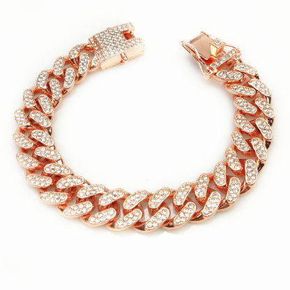 Rose gold chain bracelet with diamond-like stones and secure clasp on white background
