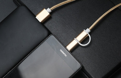 Rose gold braided 2-in-1 USB-C and micro USB fast charger cable connected to a black Huawei smartphone on black surface