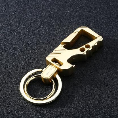 sandy gold men's leather steel car key chain pendant on black textured surface