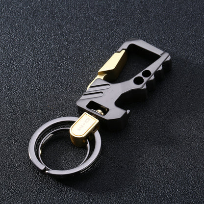 Men's leather and steel car key chain pendant in sandy gold with black textured background