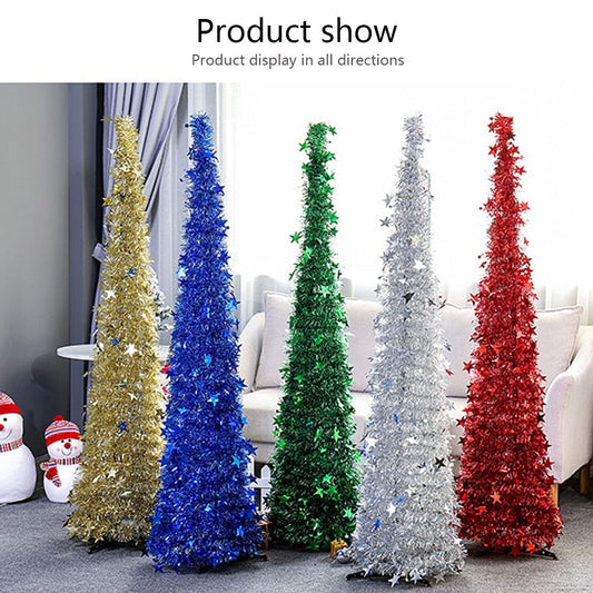 Five colorful tinsel Christmas trees in gold, blue, green, silver, and red with star decorations in a living room setting
