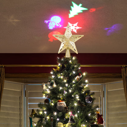 Decorated Christmas tree with warm lights and a glowing star topper projecting colorful holiday shapes on ceiling