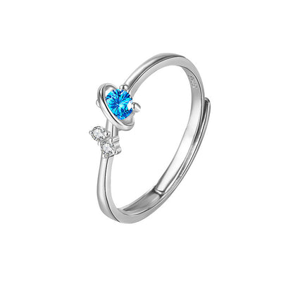 925 sterling silver open ring with blue planet-like gemstone and two small clear crystals