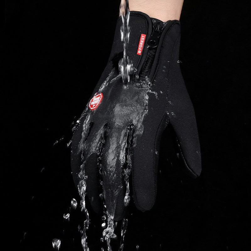 Black waterproof gloves with zipper and red label under running water, showcasing water resistance
