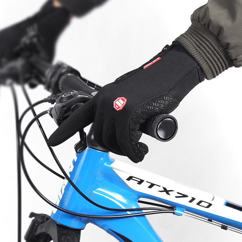 Black waterproof winter riding gloves with anti-skid grip on a blue ATX710 bike handlebar
