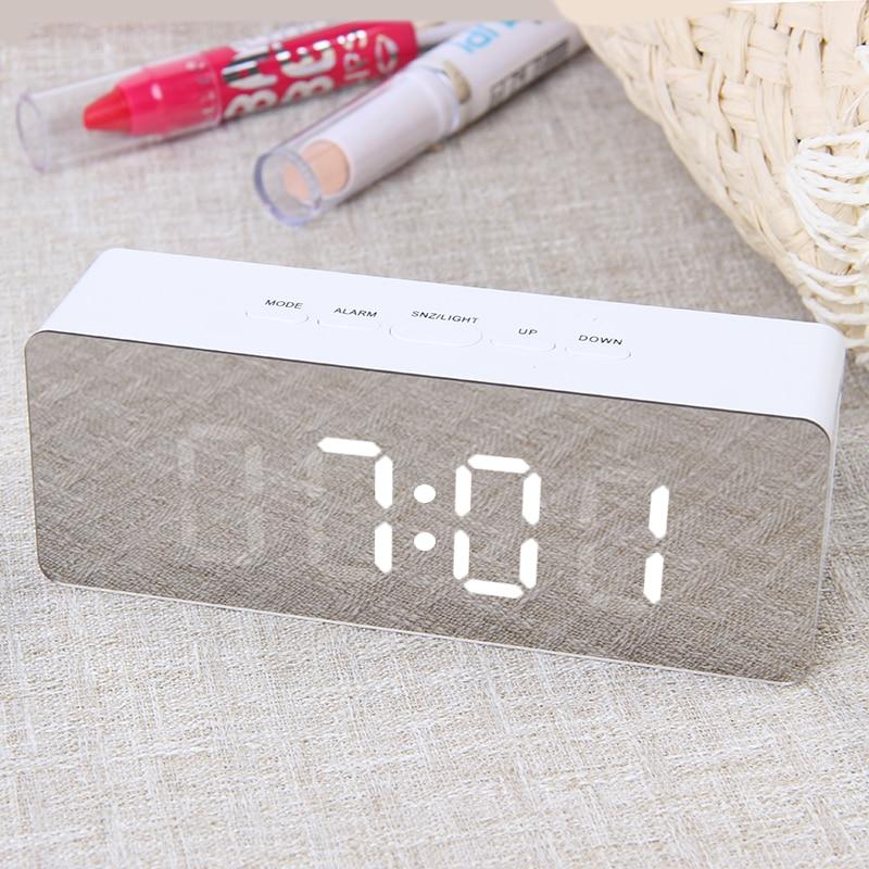 digital LED mirror alarm clock showing 7:01 with mode, alarm, light, up, down buttons on top