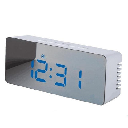 White digital LED alarm clock with blue time display on a mirrored front panel