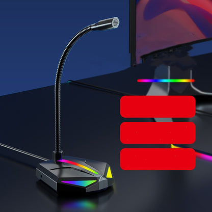 USB gaming microphone with flexible neck and RGB lighting on a black desk next to a monitor
