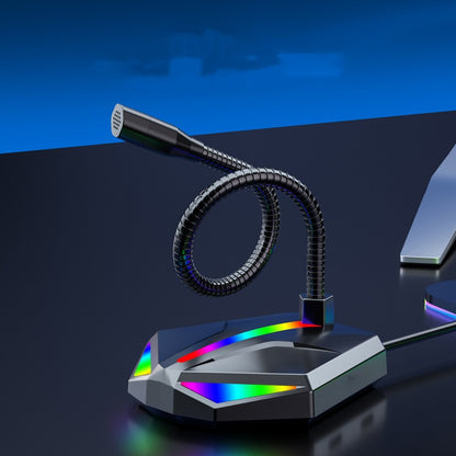 RGB USB gaming microphone with flexible gooseneck on black desk next to keyboard