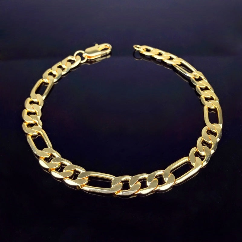gold figaro chain bracelet with alternating link sizes on black background, men's stylish accessory
