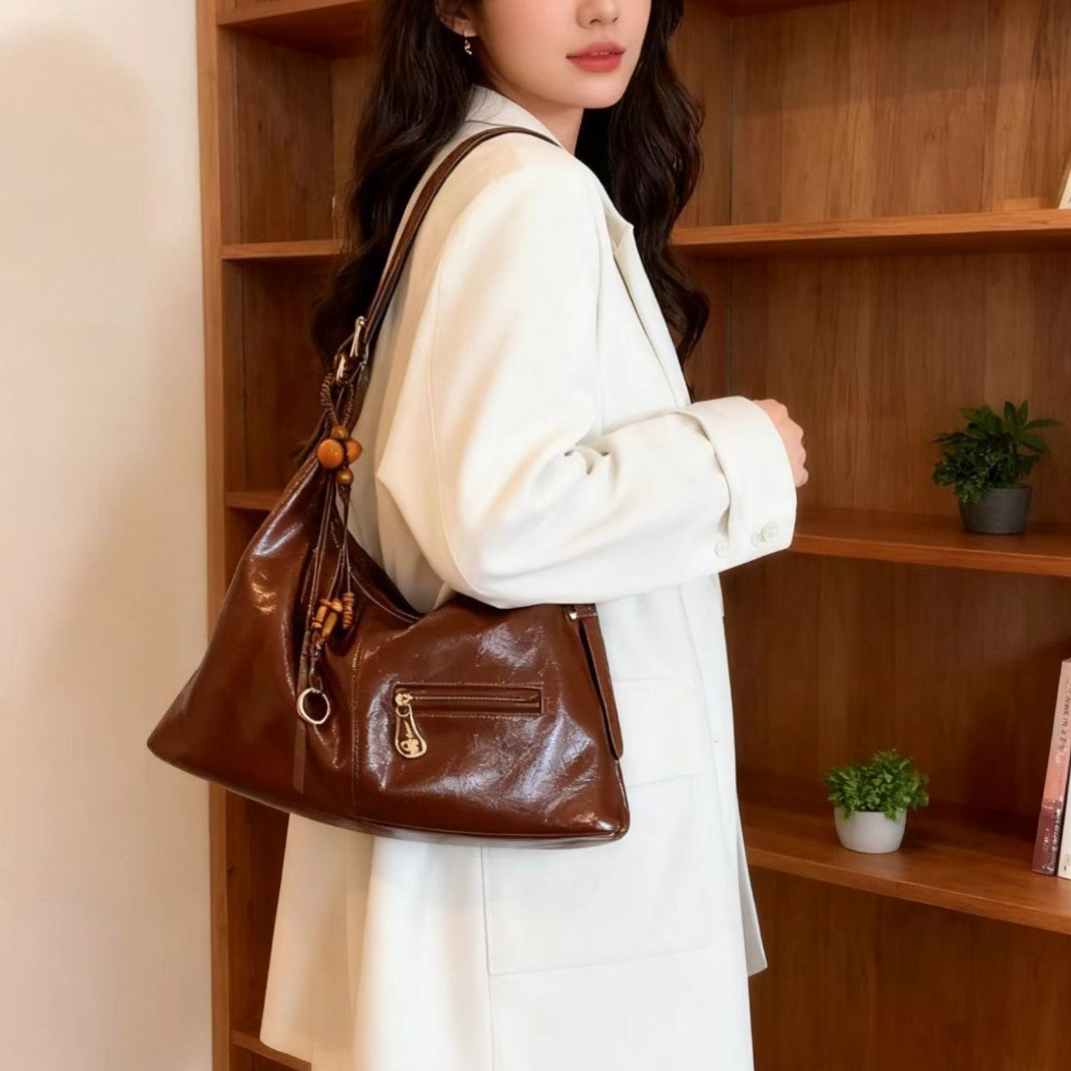 woman wearing white blazer carrying sugar brown PU leather tote bag with gold zipper