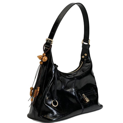 Black shiny PU leather shoulder bag with gold hardware and wooden bead tassel accessory