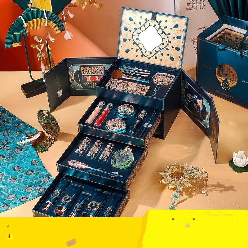 Luxury 22-piece oriental makeup set with intricate packaging, brushes, lipsticks, and skincare items on a styled surface