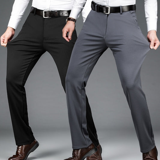 Two men wearing black and gray stretch business casual pants with white shirts and brown shoes on gray background