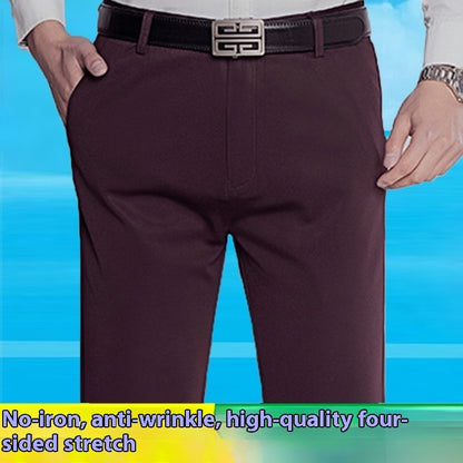 Close-up of men’s black stretch business casual pants with black belt and white shirt